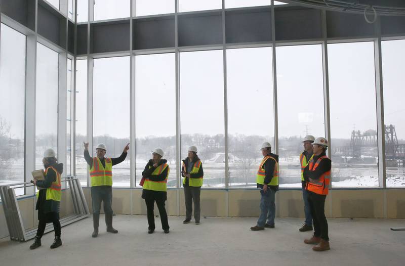 Ottawa YMCA director Joe Capece (second from left) leads a group through the new YMCA building on Wednesday Jan. 24, 2024 in Ottawa.