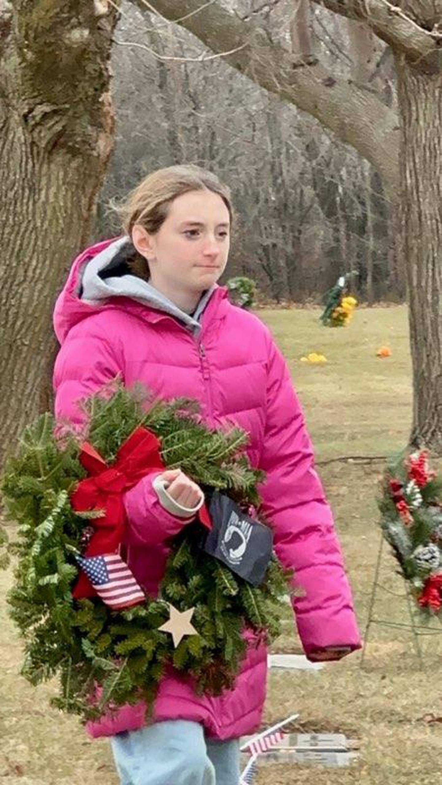 Wreaths Across America volunteers lay wreaths in Woodlawn Cemetery in December 2024.