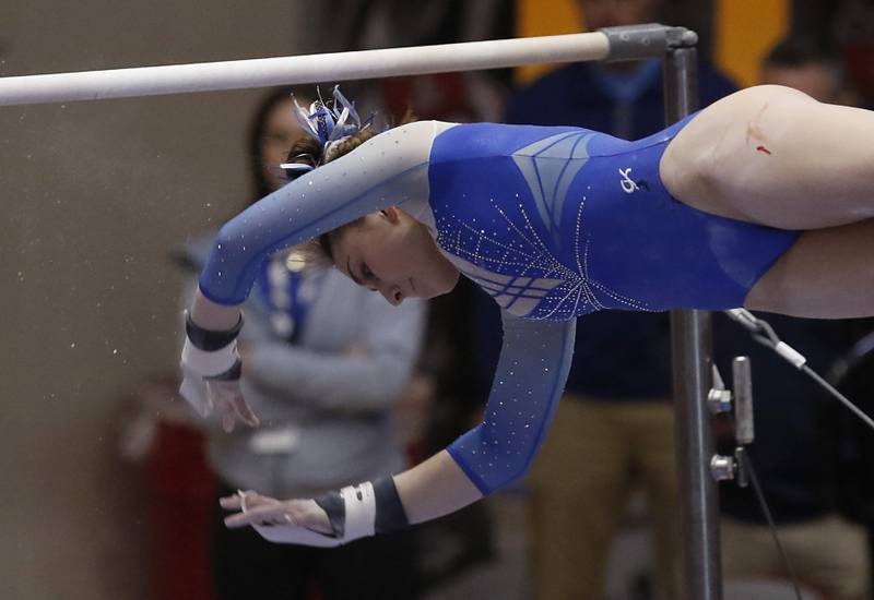 Vernon Hills' Annika Chudy competes in the preliminary round of the uneven parallel bars  Friday, Feb. 17, 2023, during the IHSA Girls State Final Gymnastics Meet at Palatine High School.