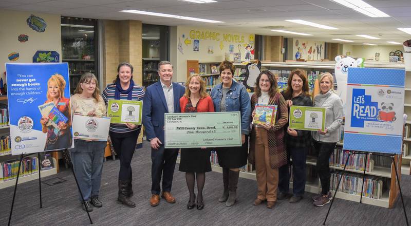 Members of the Lockport Woman’s Club present a $5,000 donation to the Imagination Library of Will County. The program, which mails free, high-quality, and age-appropriate books to children from birth to age five, is the result of a partnership between Will County Executive Jennifer Bertino-Tarrant, the Will County Center for Economic Development and The Dollywood Foundation.