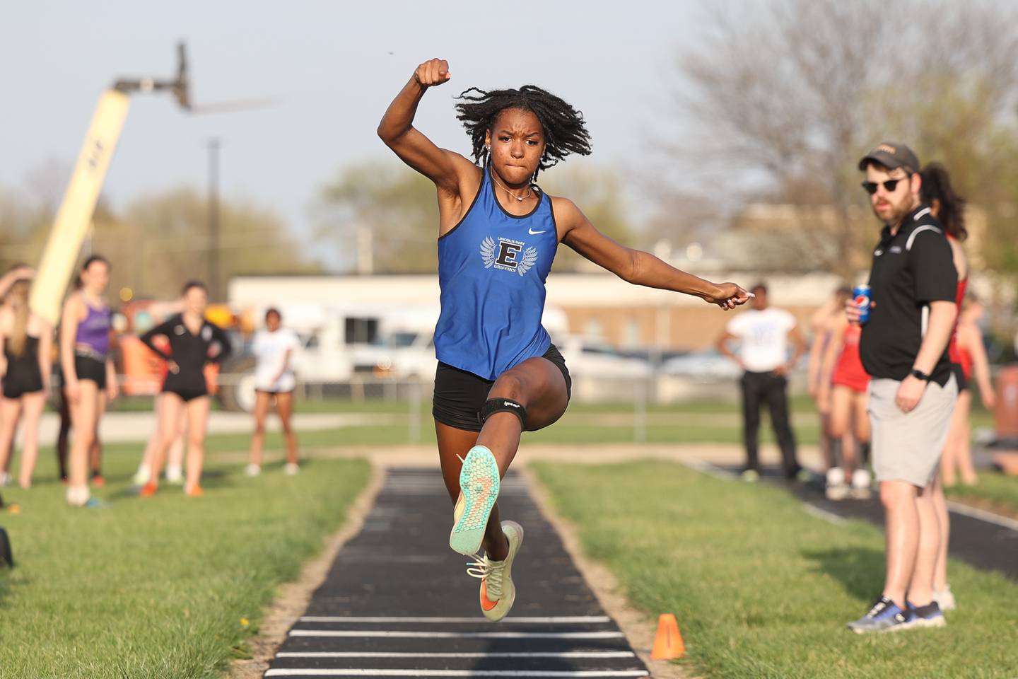 Lincoln-Way East’s Asha Pierre-Antoine competes in the triple jump at the Minooka Girls Track and Field Invitational on Friday, April 14, 2023.