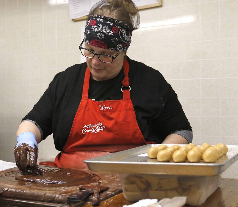 Colleen Vineyard makes Easter eggs on Thursday, March 27, 2025, at Anderson's Candy Shop in Richmond.