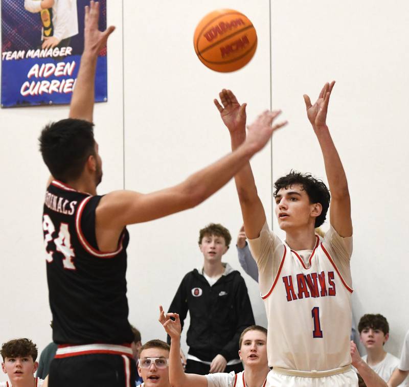 Oregon's Benny Olalde shoots a three-pointer as Forreston's Mickey Probst tries to block it on Tuesday, Feb. 17, 2026 at the Blackhawk Center in Oregon.