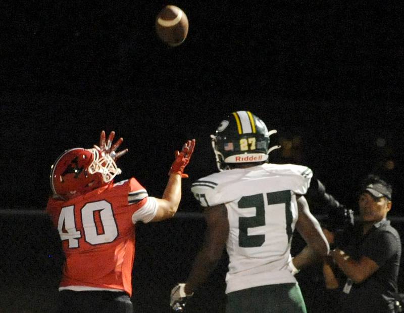 Yorkville receiver Blake Kersting (40) waits to catch a pass for a touchdown against Plainfield Central defender Quenton Howard (27) during a varsity football game at Yorkville High School on Friday, Sep. 2, 2022.