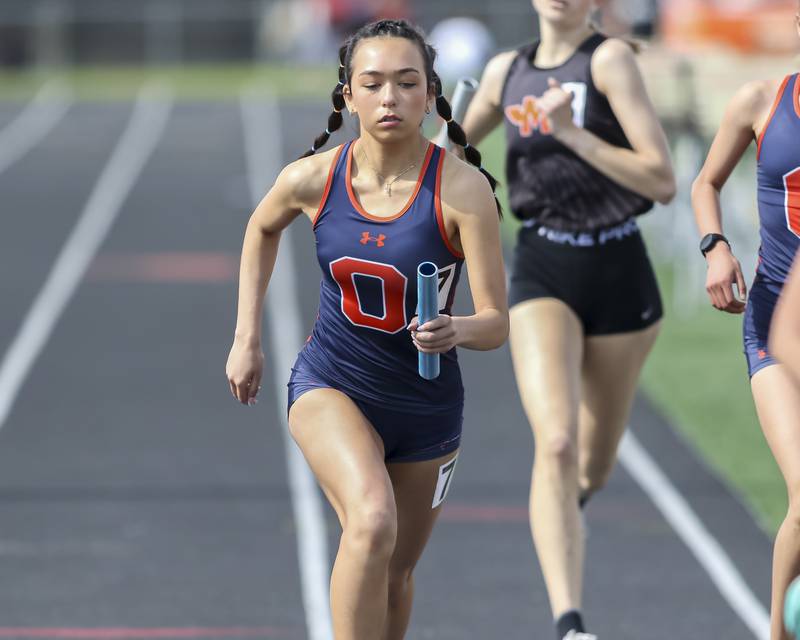 Oswego's Lindsay Arand anchors in the 4x800m during Southwest Prairie Conference Girls Track and Field Meet Wednesday, May 7, 2025 in Minooka.