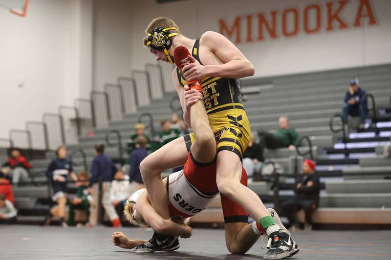 Joliet West’s Jakob Crandall works over Plainfield North’s Aidan Durell in the SouthWest Prairie Conference 126 pound championship on Saturday, Jan. 24, 2026 in Minooka.