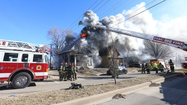 Photos: La Salle firefighters battle two-story house fire on Bucklin Street