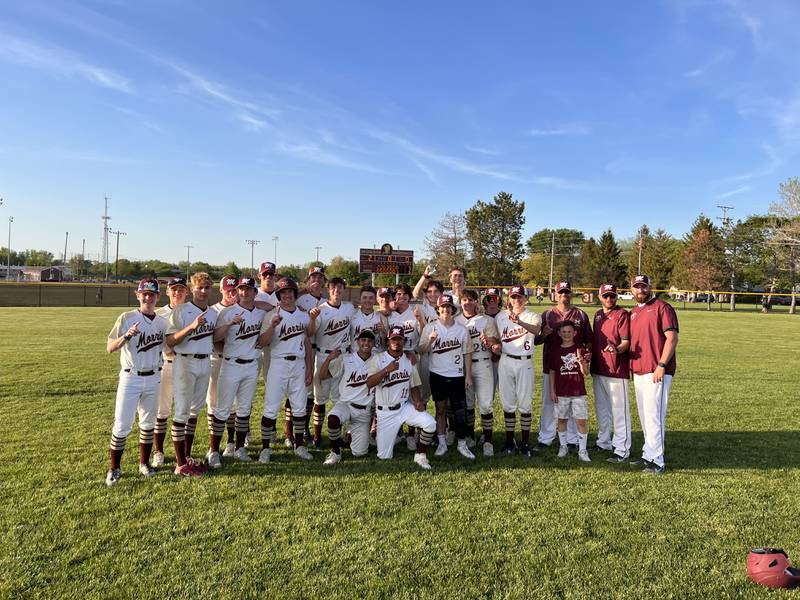 The Morris baseball team celebrates after beating Sycamore to win the Interstate 8 Conference championship on Wednesday, May 10.