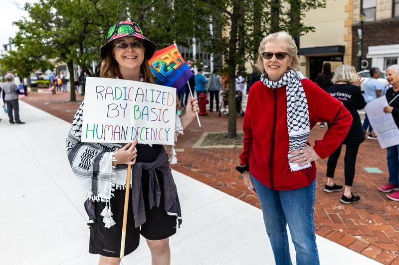 Teri Karl and Charlotte Droogan, Lay Minister at Universalist Unitarian Church of Joliet, participate in the Good Trouble Lives On event in Downtown Joliet on July 17, 2025.