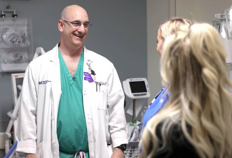 Dr. Gregory Conrad talks to nurses Randa Melms and Nicole Lefever in the emergency room Thursday, April, 18, 2024, at Northwestern Medicine Kishwaukee Hospital in DeKalb.