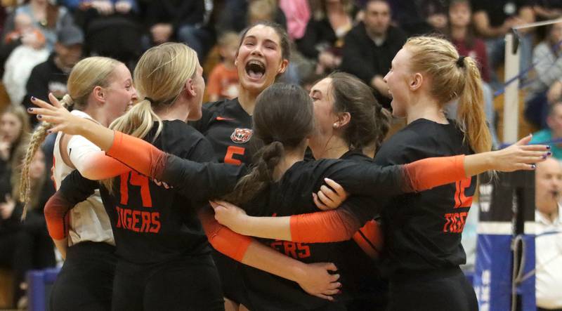 Crystal Lake Central’s Tigers get revved up during a two-set win over Woodstock North in IHSA girls volleyball Class 3A Regional Championship action at Woodstock High School in Woodstock on Thursday, October 30, 2025.