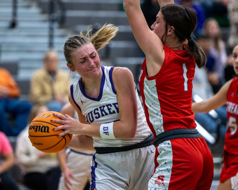 Kendall Whiteaker (21) of Serena holds ball as Rhea Huey (1) of Streator defends on Monday, November 17, 2025 at Seneca High School in Seneca.
