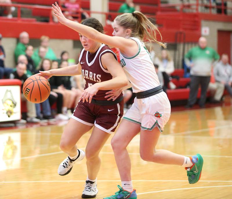 Morris's Moriah Mayberry dribbles around Geneseo's Adison Snodgrass during the Class 3A Regional basketball game on Tuesday, Feb. 14, 2023 at Ottawa High School.