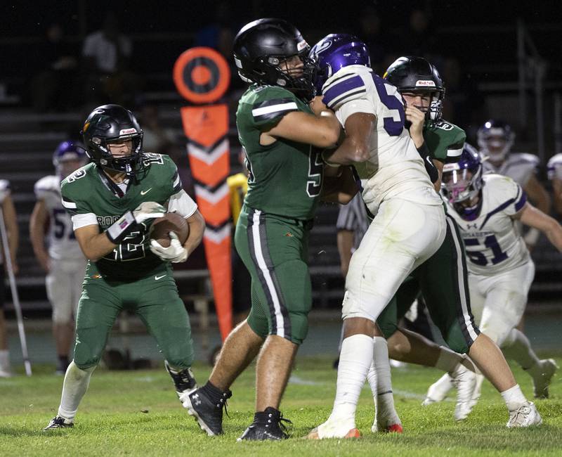 Rock Falls’ Austin Casteneda looks for running space against Rockford Lutheran Friday, Sept. 20, 2024, at Hinders Field in Rock Falls.
