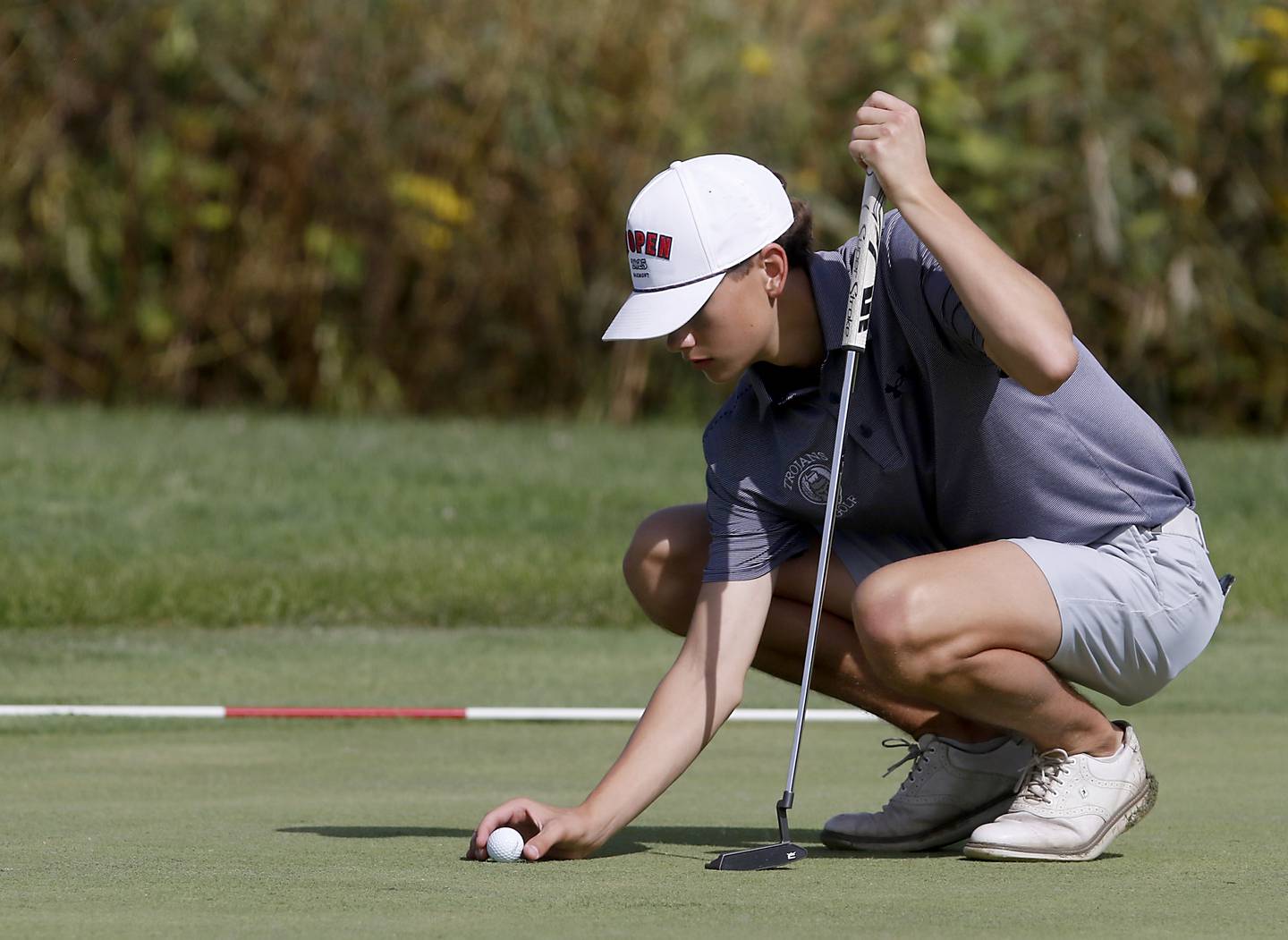 Cary-Grove’s Conner Lentz lines up his putt on the seventh green during the IHSA Class 2A Crystal Lake South Boys Golf Regional on Wednesday, Oct. 1, 2025 at RedTail Golf Club in Lakewood.