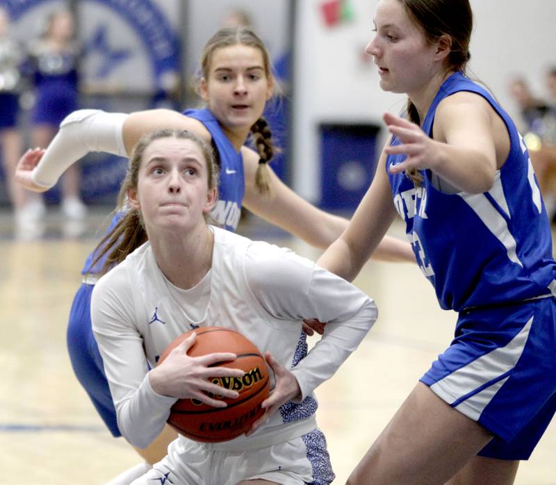 St. Charles North’s Julia Larson looks for an opening under the basket during the Class 4A St. Charles North Regional final against Wheaton North on Thursday, Feb. 16, 2023.