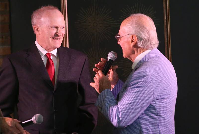 Western alumnus Lonnie Hewitt, who was a three-time state high jump champion speaks with emcee Lanny Slevin during the 2025 Shaw Media Illinois Valley Sports Hall of Fame at the Auditorium Ballroom in La Salle.