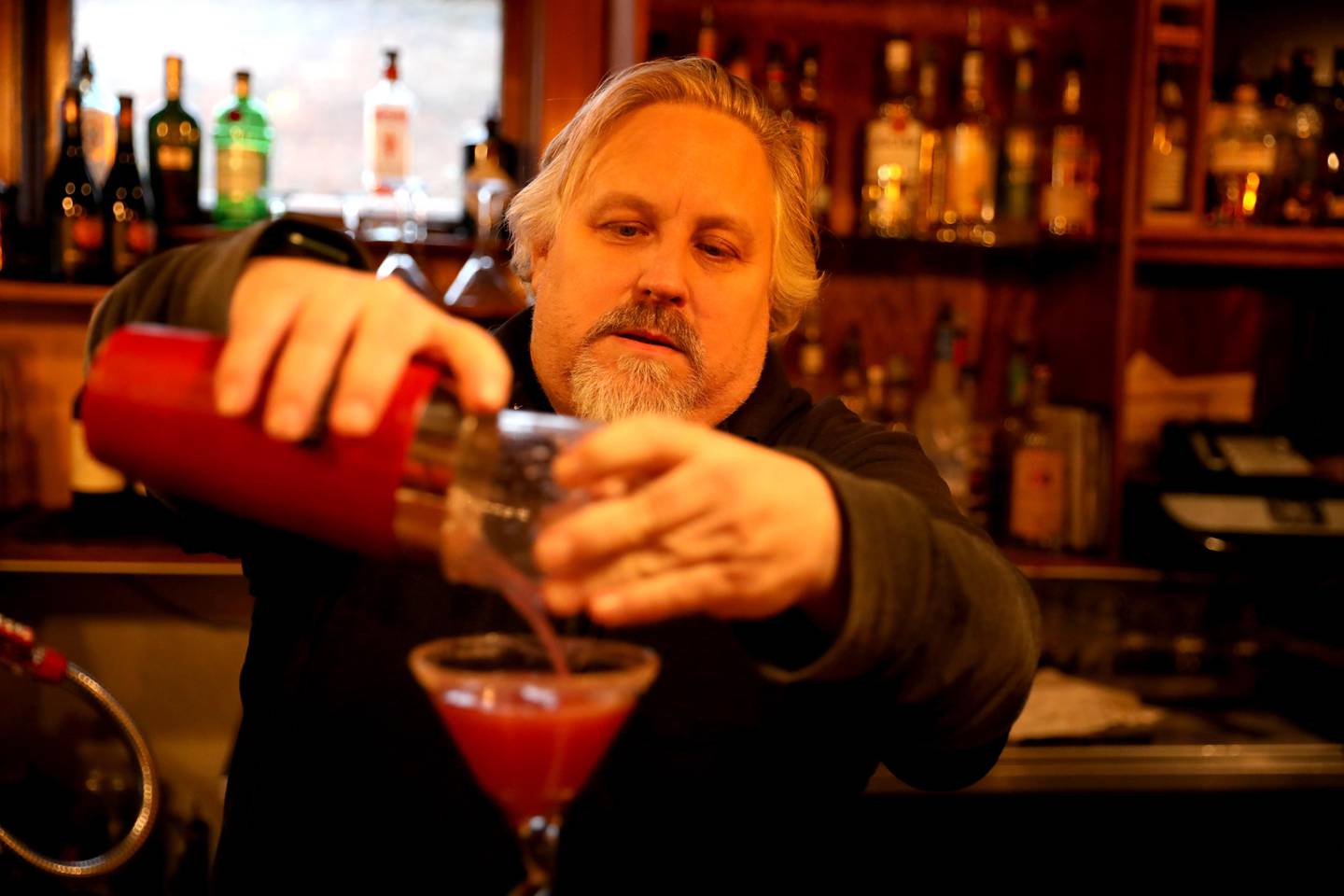 John Fleming pours a martini at J. Fleming’s Absolutely Delicious restaurant in Westmont. The restaurant will be participating in the Westmont Chamber of Commerce and Tourism Bureau’s Restaurant Week Jan. 19-29, 2023.