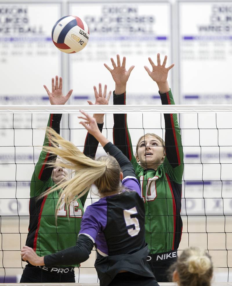 L-P’s Emma Jereb (left) and Kelsey Frederick go up for a block against Dixon’s Morgan Hargrave Tuesday, Oct. 29, 2024, at the class 3A regional semifinal in Dixon.