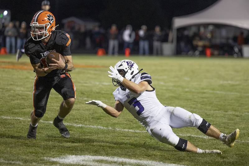 Byron’s Andrew Talbert picks off a pass in front of Dixon’s Jake Zepezauer Friday, Sept. 5, 2025, at Byron High School.