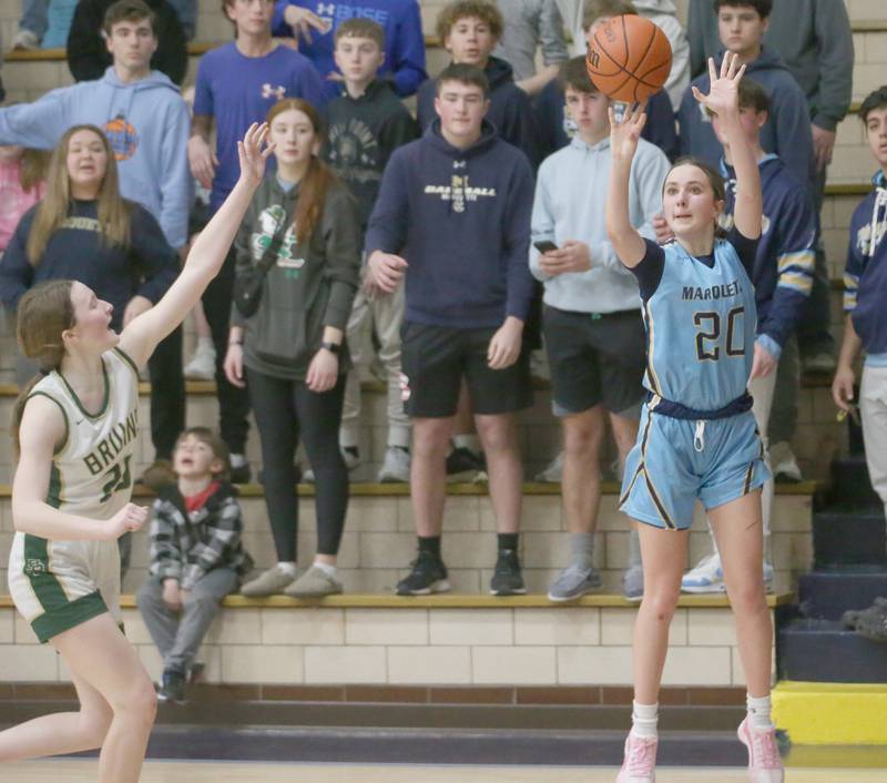 Marquette's Kaitlyn Davis shoots a wide-open shot over St. Bede's Lili McClain during the Class 1A Regional semifinal game on Monday, Feb,. 12, 2024 in Bader Gym.