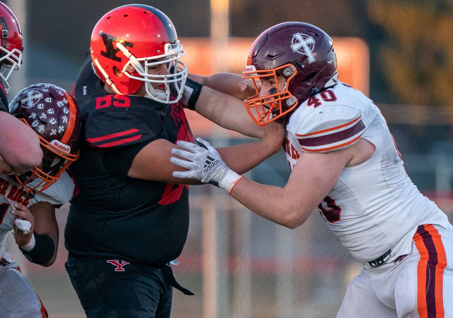 Yorkville's Adrian Alvarez (65) and Brother Rice's James Hogan (40) battle on the line of scrimmage during a a 7A state football playoff game at Yorkville High School on Saturday, Nov. 6, 2021.