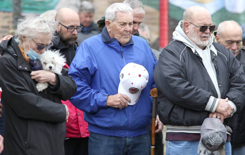 Veterans and attendees bow their heads in prayer during a Veterans Day and Soldiers and Sailors Memorial Clock rededication ceremony at Memorial Park in downtown DeKalb.