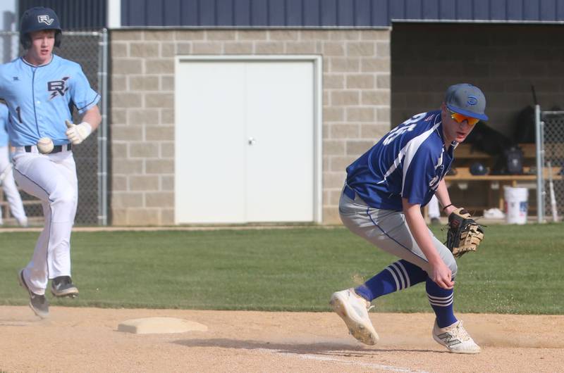 The ball gets away from Princeton's Jace Stuckey as Bureau Valley's Bryce Helms reaches first base on Thursday, April 25, 2024 at Bureau Valley High School.