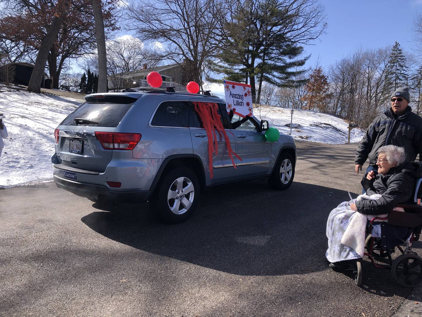 Spring Grove resident Lillian Bennett watches her 108th birthday party parade go by Feb. 24, 2024