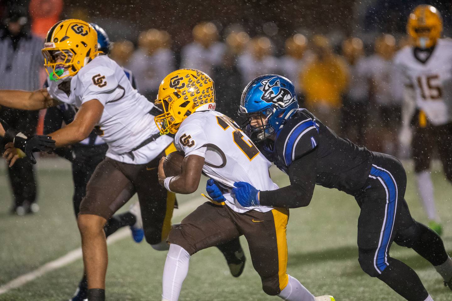 St. Charles North's Wyatt Brandt tackles Carmel's Vinny Fiore at the Class 7A Second Round playoff game on Saturday, Nov.8,2025 in St. Charles.