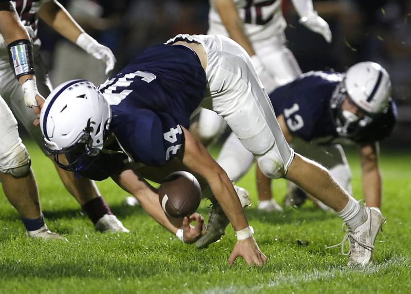Cary-Grove's Jack Rocen fumbles the ball as he returns a punt during a Fox Valley Conference football game against  Prairie Ridge on Friday, Sept. 22, 2023, at Cary-Grove High School in Cary.