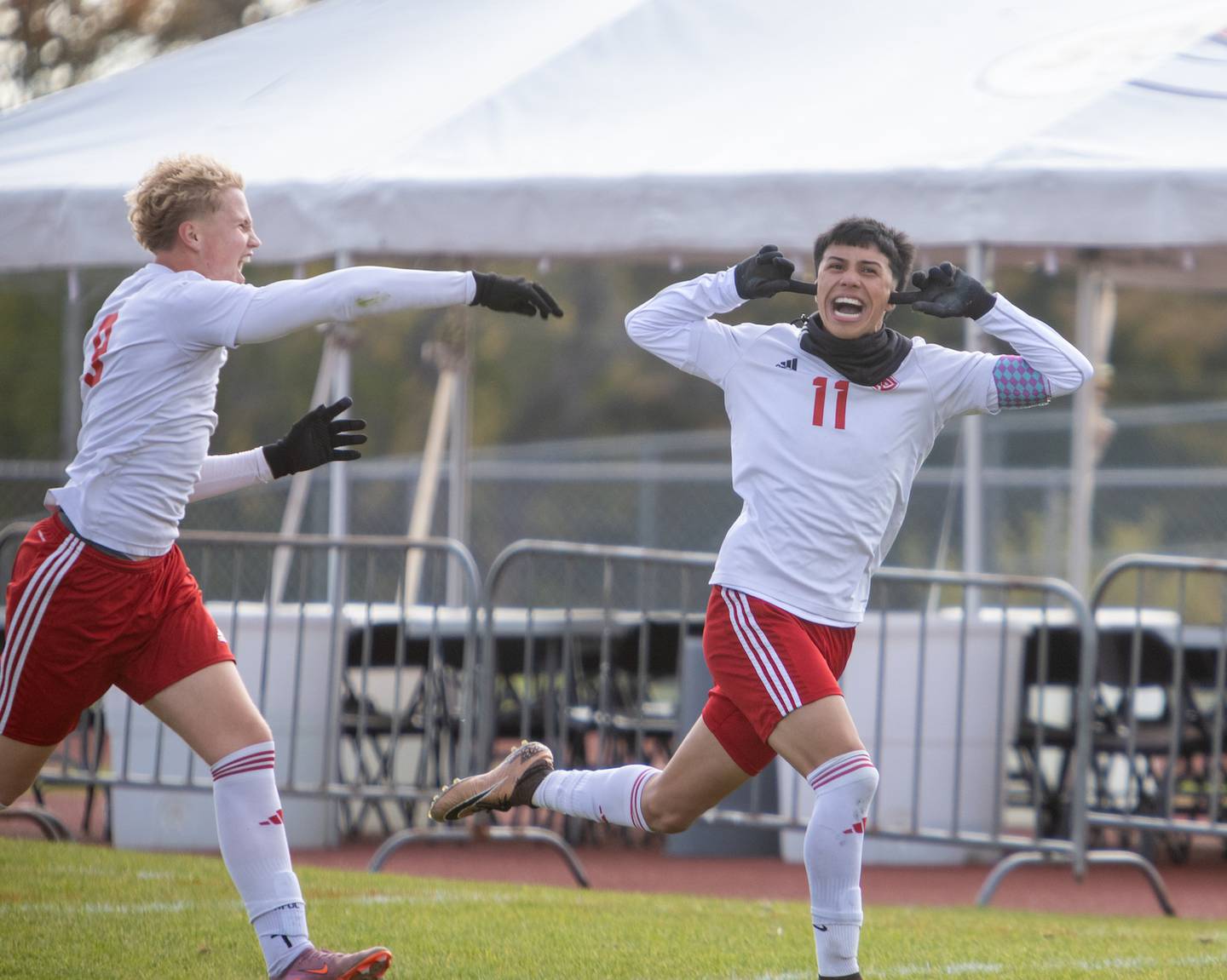 South Elgin's Pelon Munoz (11) celebrates scoring a goal with Matthew Lipp (9) against St. Charles North at the Class 3A Sectional Final on Saturday, Nov. 1,2025 in South Elgin.