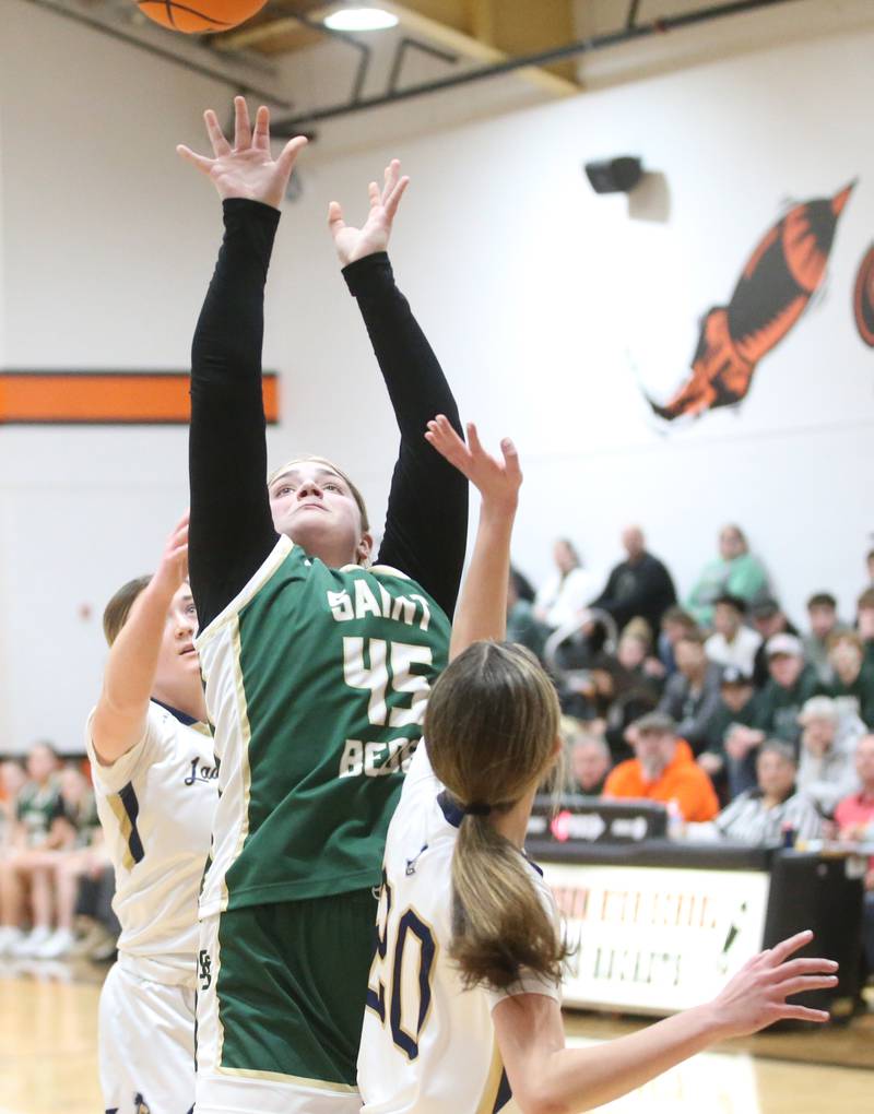 St. Bede's Savannah Bray shoots a jump shot over Marquette's Kaitlyn Davis during the Tri-County Conference championship game on Thursday, Jan. 23, 2025 at Roanoke-Benson High School.