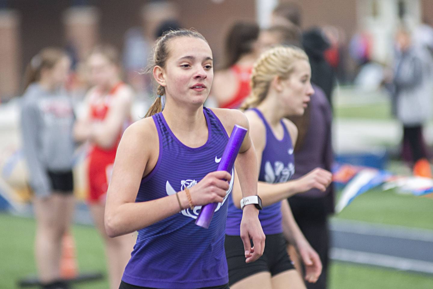 Dixon's Keely Mick runs the third leg of the 4x200 Friday, April 29, 2022 at the Sterling Night Relays.