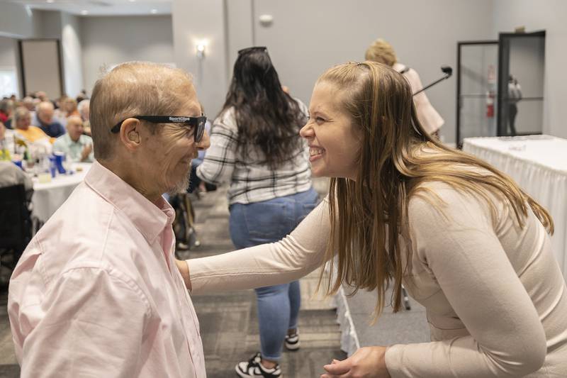 Self Help Director of Programming Jessica Craft celebrates with client Gary Johnson on his receiving a 20 year pin Thursday, Oct. 17, 2024, at the client awards banquet.