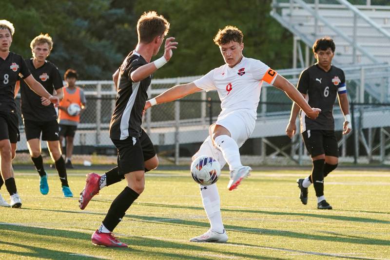 Oswego’s Dustin King (9) shoots the ball for a goal against Wheaton Warrenville South during a soccer match at Wheaton Warrenville South in Wheaton on Thursday, Aug 28, 2025.