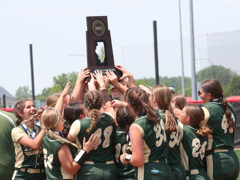 Members of the St. Bede softball team hoist the Class 1A State championship trophy after defeating Illini Bluffs on Saturday, June 3, 2023 at the Louisville Slugger Sports Complex in Peoria.