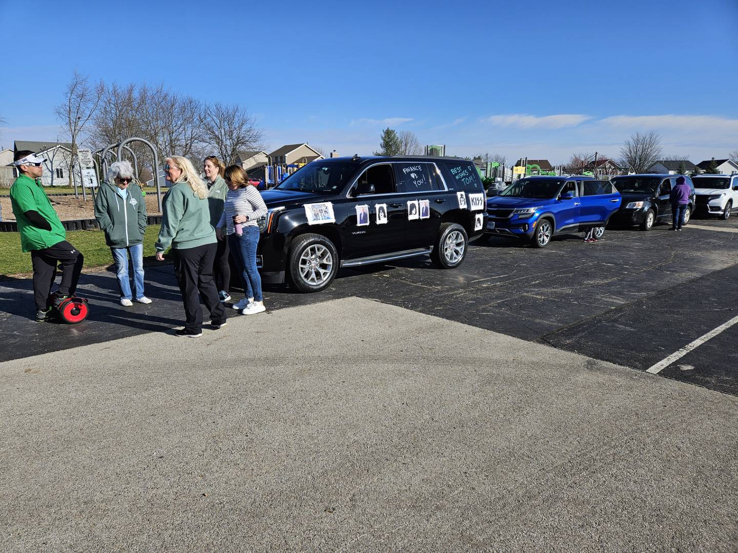 Cars line up in the parking lot of Lakewood Elementary School in Plainfield on Saturday, March 16, 2024, for “The Amazing Tom Hernandez” car parade, hosted by Plainfield Community Consolidated School District 202. Hernandez, who has battled brain cancer for almost two years, is the former director of community relations for District 202 in Plainfield.