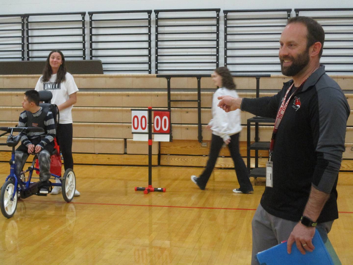 Yorkville High School physical education teacher John Ernser offers encouragement in his adapted PE course for students with disabilities.