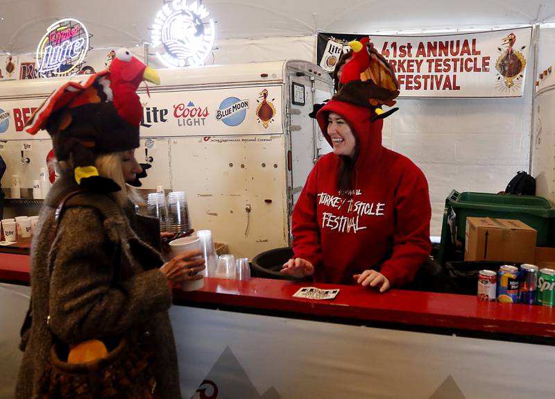 Bar tender Meg Blankenskip talks with Judy Sarvas Wednesday afternoon, Nov. 22, 2023, during the 41st annual Turkey Testicle Festival at Parkside Pub, in Huntley. The pre-Thanksgiving festival featured live music, beer, and lots of deep-fried turkey testicles.