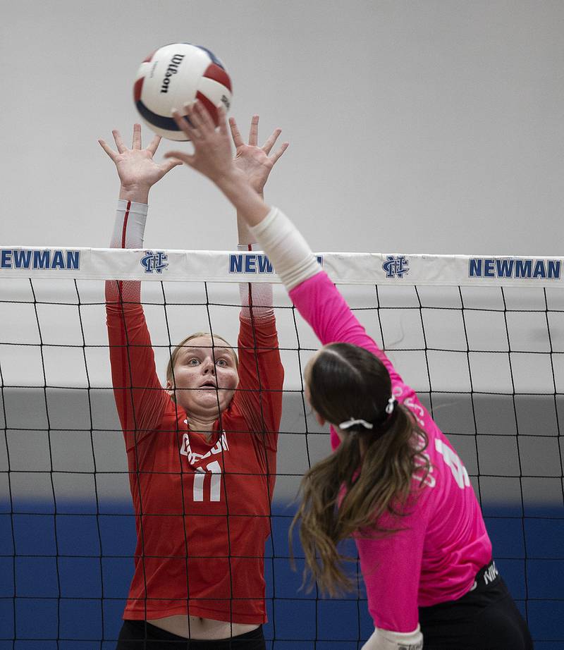 Oregon’s Izzy Berg goes for the block against Newman’s Ruby Burger Thursday, Sept. 11, 2025.