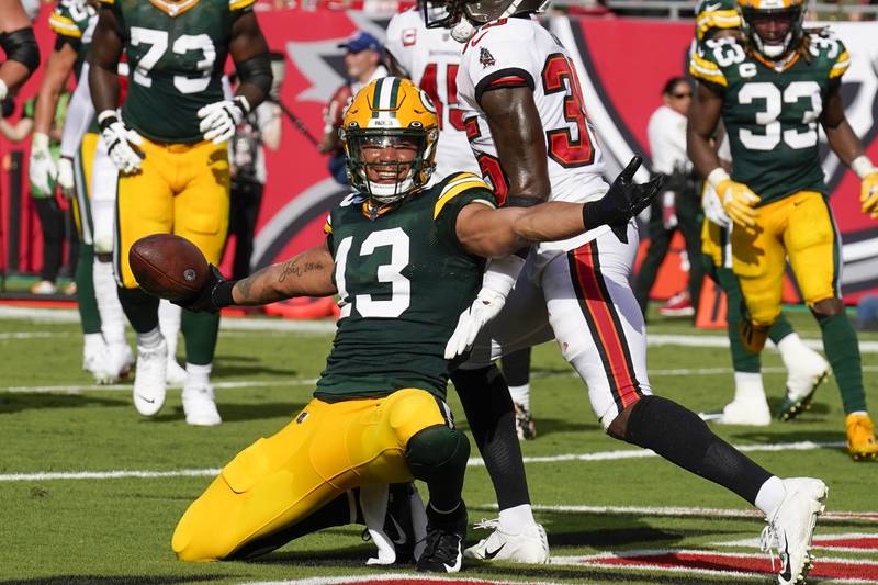 Green Bay Packers' Allen Lazard reacts after catching a touchdown pass during the first half of an NFL football game Sunday, Sept. 25, 2022, in Tampa, Fla. (AP Photo/Chris O'Meara)