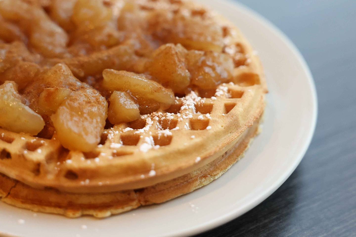 A plate of the Apple Cinnamon waffles sits on the table at Jitterhead on Wednesday, Dec. 11, 2024 in Crest Hill.