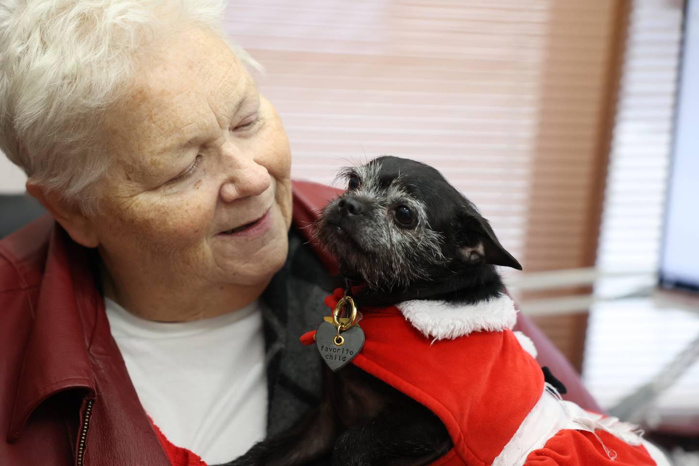 Sandra L Perzee holds Ivory, a Chihuahua mix, at MorningStar Mission in Joliet. Sandra will become Director Emeritus at the non-denominational organization.