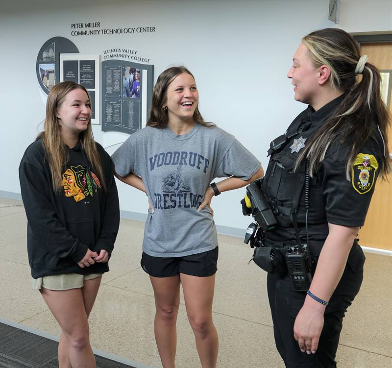Oglesby Police School Resource Officer Randy Leininger (right) spoke recently with incoming freshmen Payton Giordano (left) and Mia Waters, both of Oglesby. Leininger will be assigned to Illinois Valley Community College full-time beginning June 1.