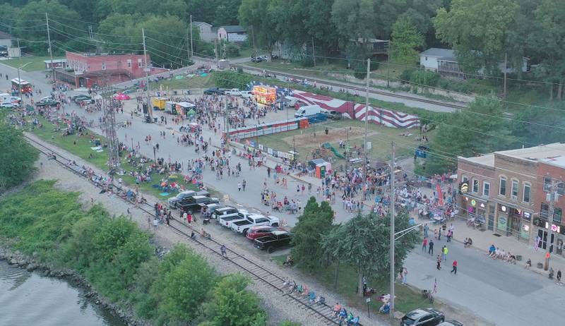 A large crowd gathers along Water Street an hour before the  fireworks on Wednesday, July 3, 2024 in Peru.
