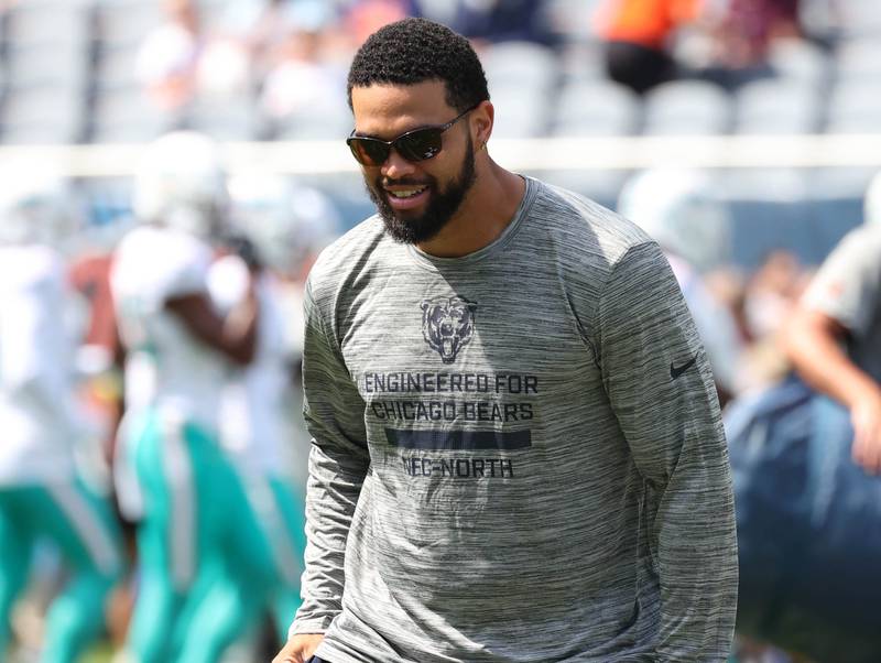 Chicago Bears quarterback Caleb Williams talks players as they do stretches Sunday, Aug. 10, 2025, before their preseason game against the Miami Dolphins at Soldier Field in Chicago.