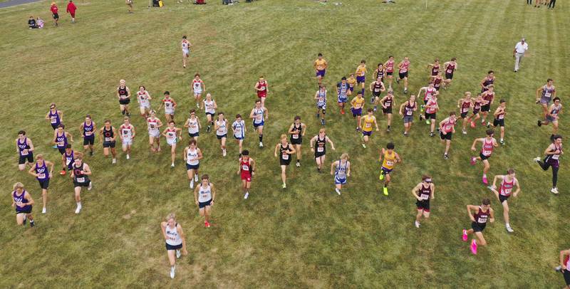 An aerial view of the varsity boys race as it kicks off during the Gary Coates Invitational cross country meet on Saturday, Sept. 13, 2025 at Zearing Park in Princeton .