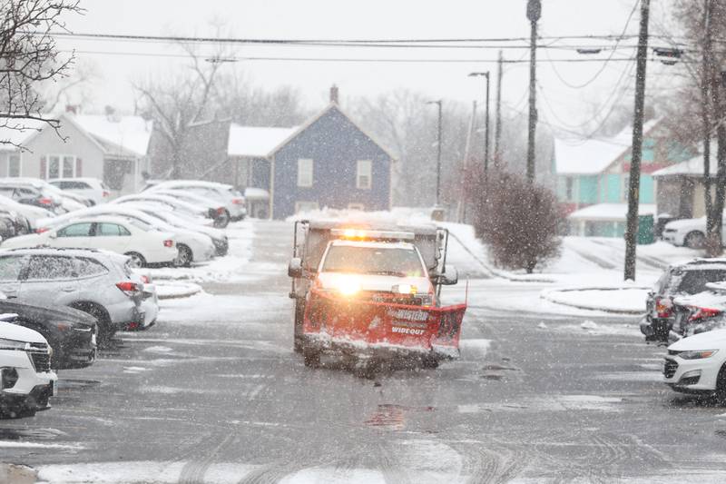 A truck salts the parking lot of University of St. Francis on Tuesday, Jan. 9th, 2024 in Joliet.