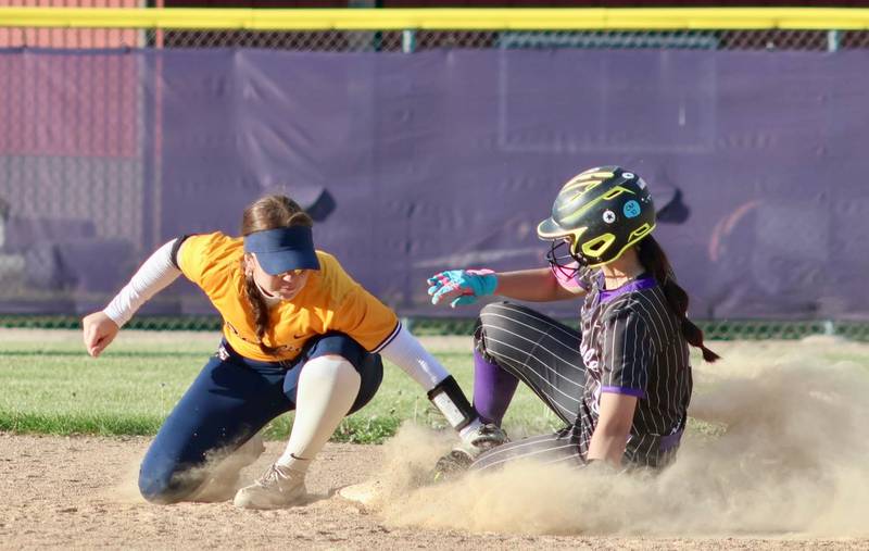 Rochelle's Mya Martinez slides into second base during the Hubs' game with Sterling.